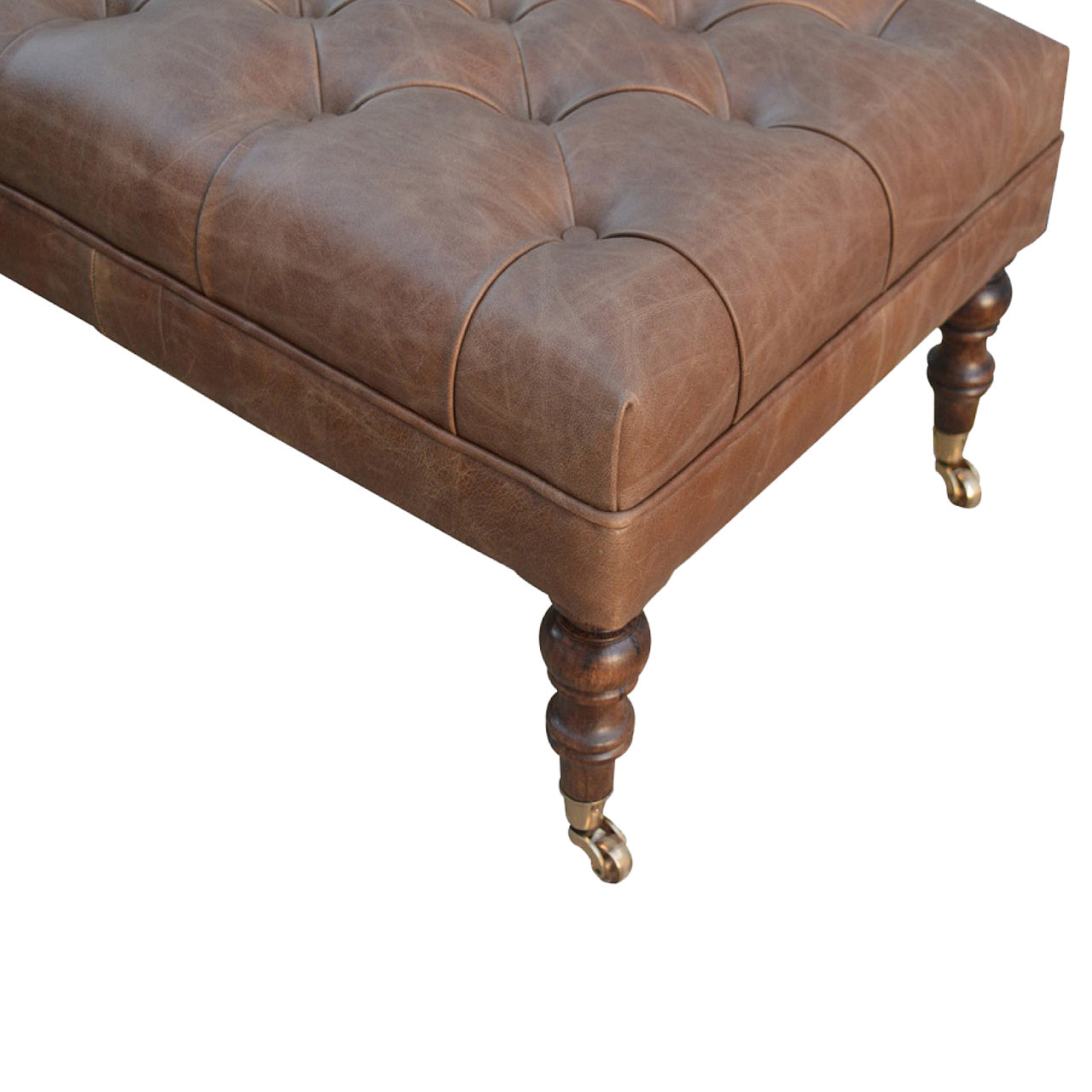 https://www.artisanfurniture.net/buffalo-leather-ottoman-with-castor-legs/